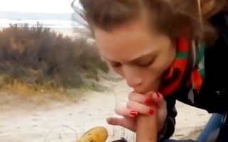 Kissable chick is sucking on his hot dog outdoors and gets used doggystyle