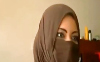 Seductive Arabic gal is staring into a camera stretching her wet crack lips