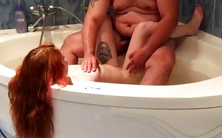Fine ginger-haired teen pleases a meaty rich sir in his baths